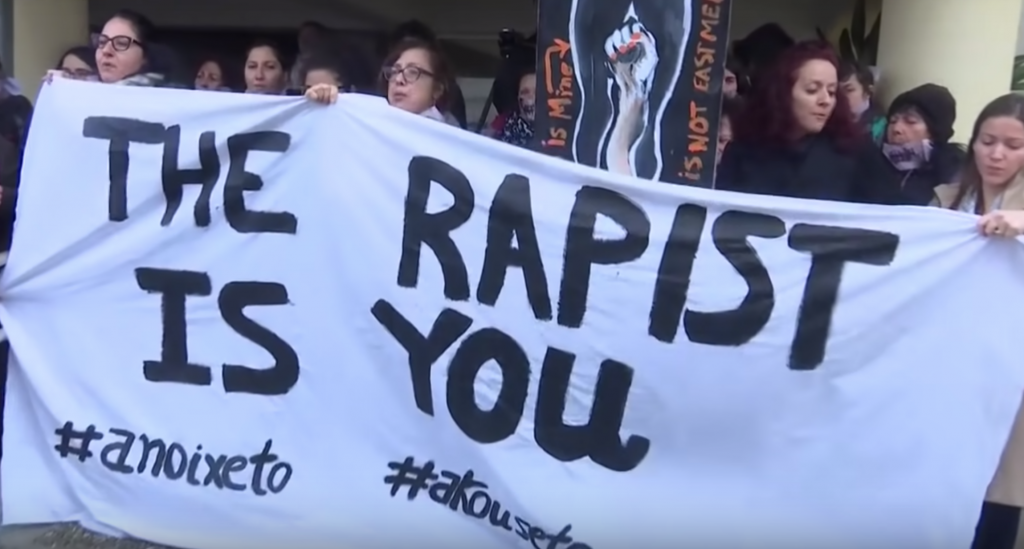 Protesters gather outside the court during the sentencing of a 19-year-old found guilty of lying about a gang rape incident. Credit: YouTube. 