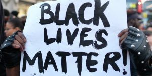 A Black Lives Matter sign at an anti-racist protest in London