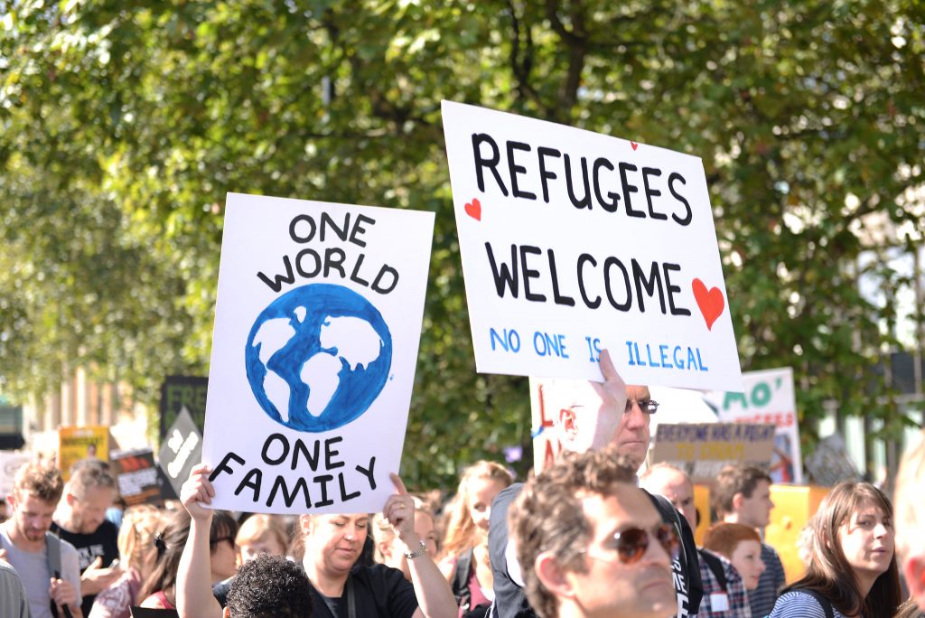 Refugee welcome signs in an article about the asylum system 