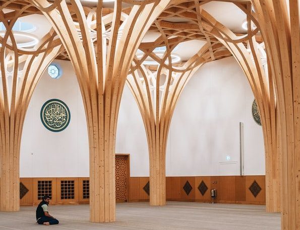 A man praying in Europe's first eco-friendly mosque in Cambridge, England