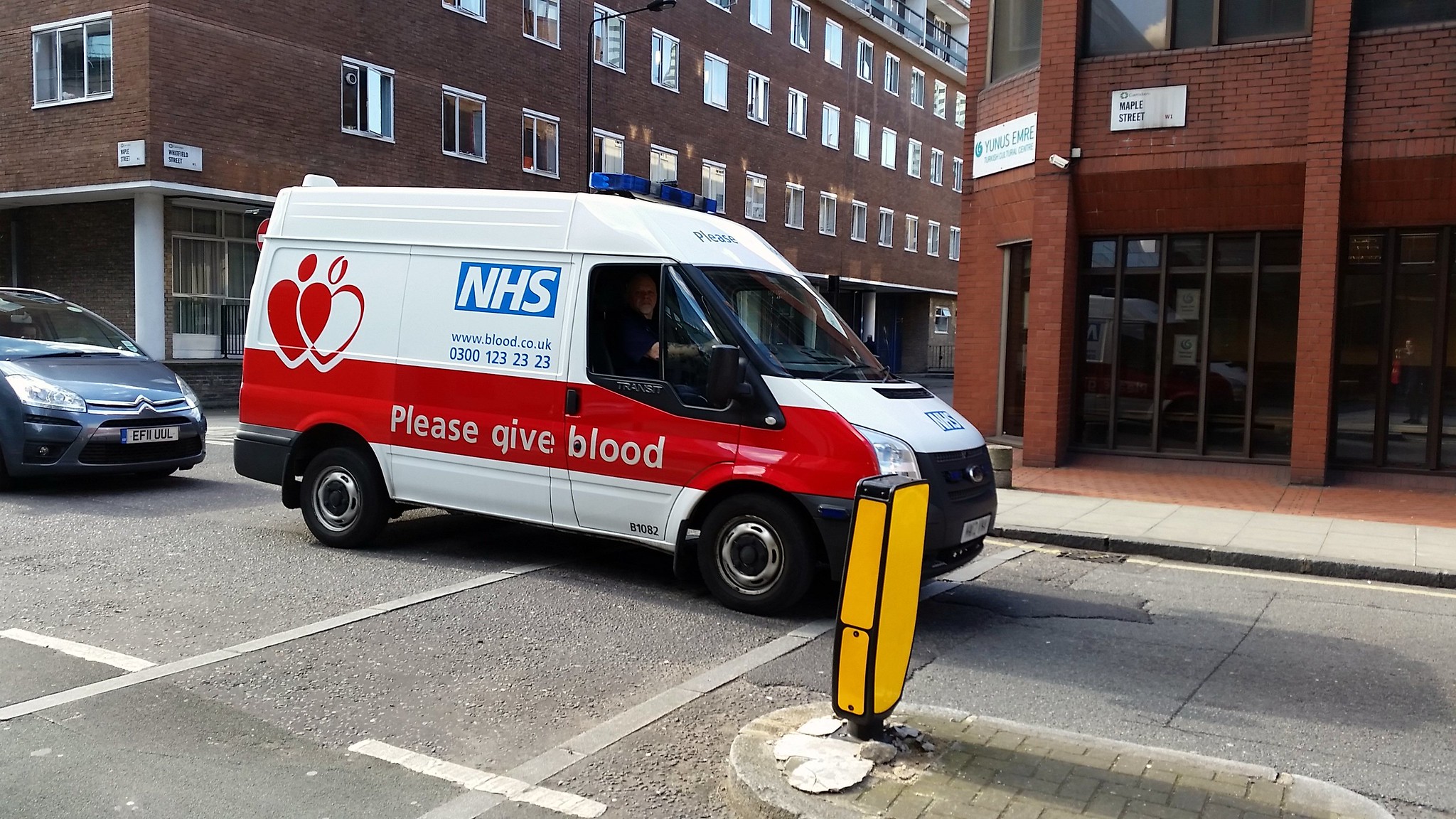 NHS Blood Donation Van Driving On Street