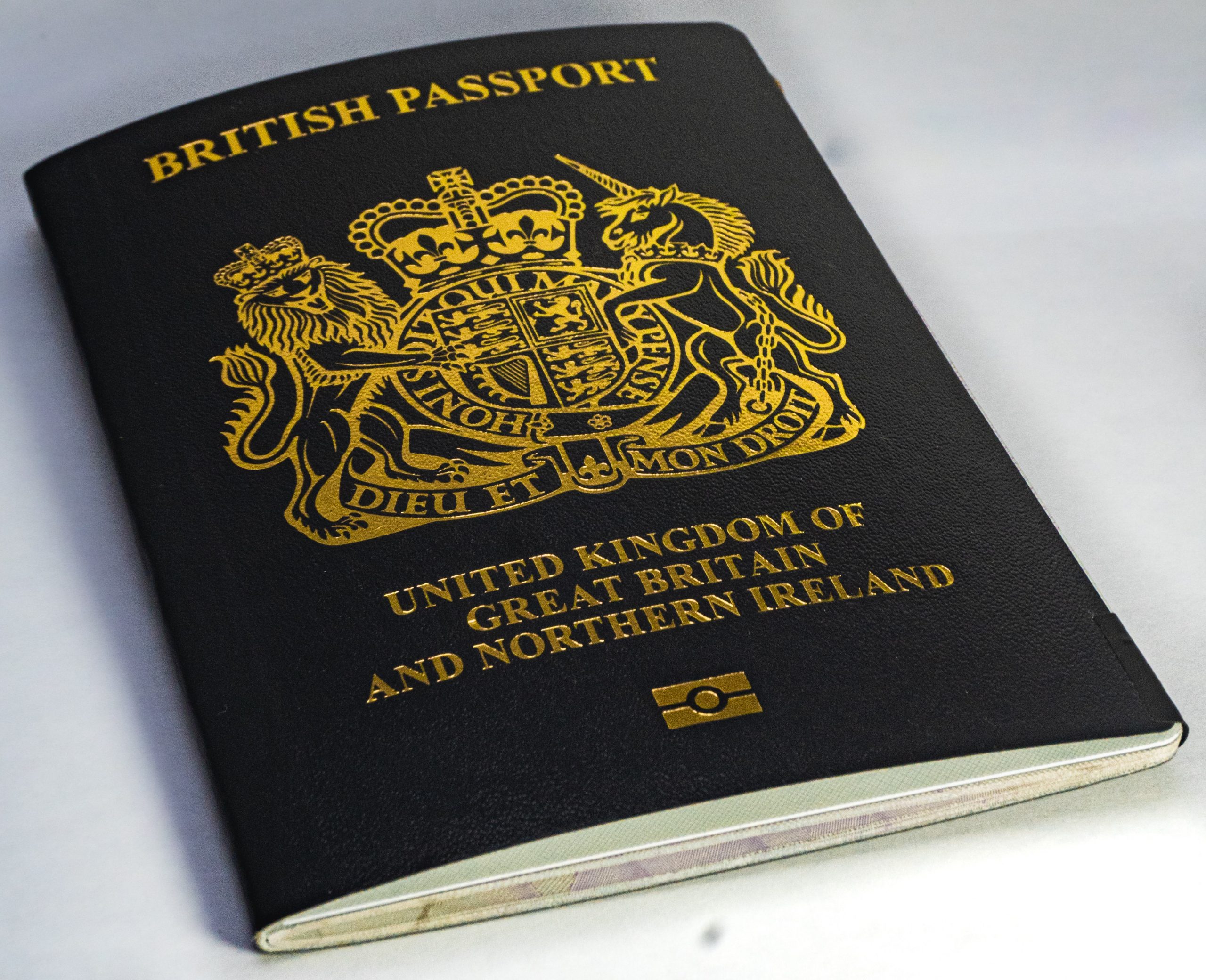 A British passport sits on a white table