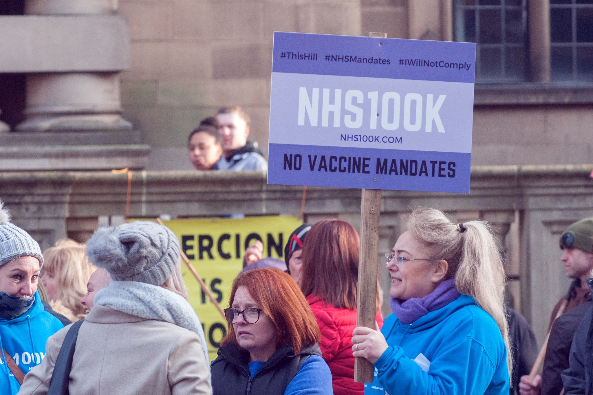 NHS Staff protest vaccinations in Sheffield. A sign reads "no vaccine mandates"