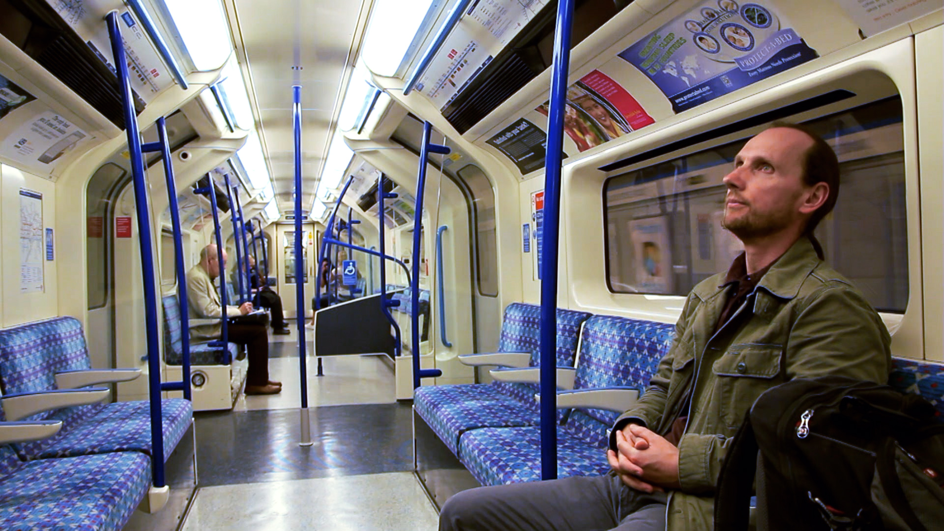 Kemal Pervanic rides a tube in London