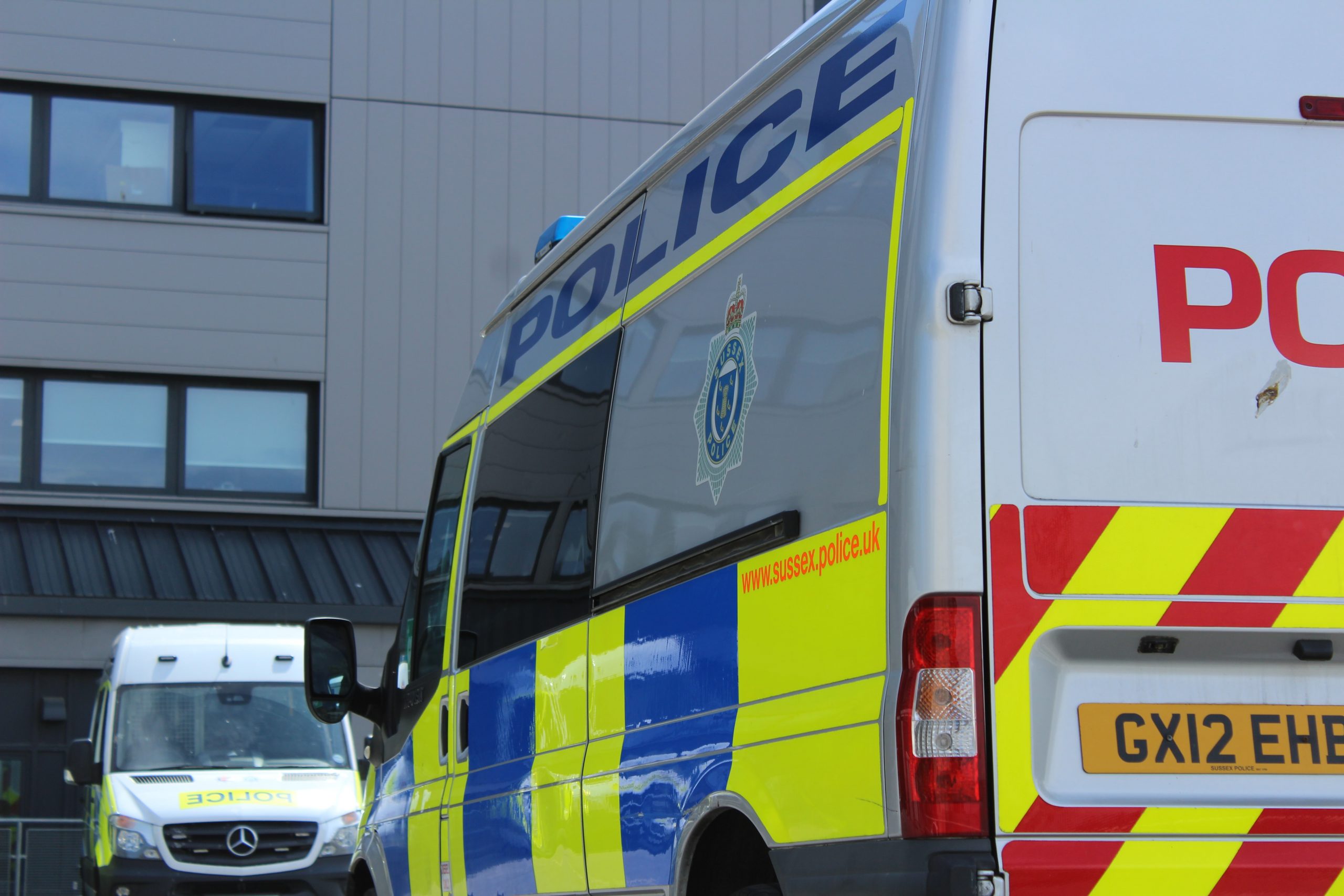 The photo shows a side shot of a police van 
