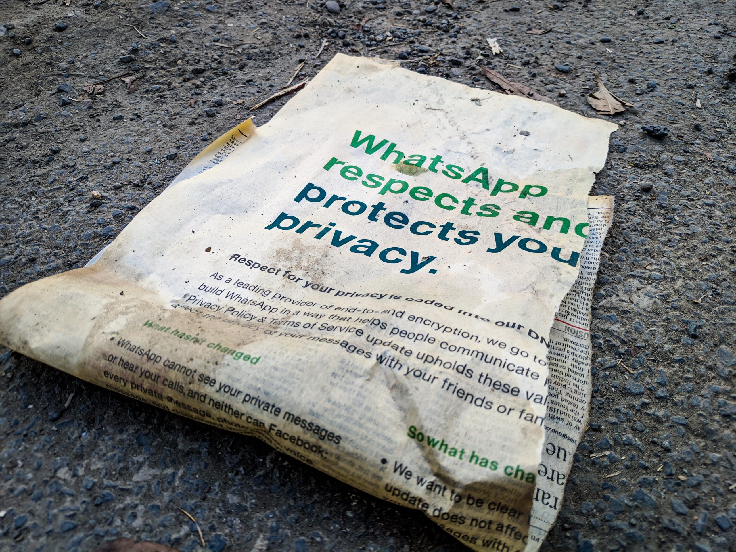 newspaper with text that says Whatsapp respects and protects you privacy