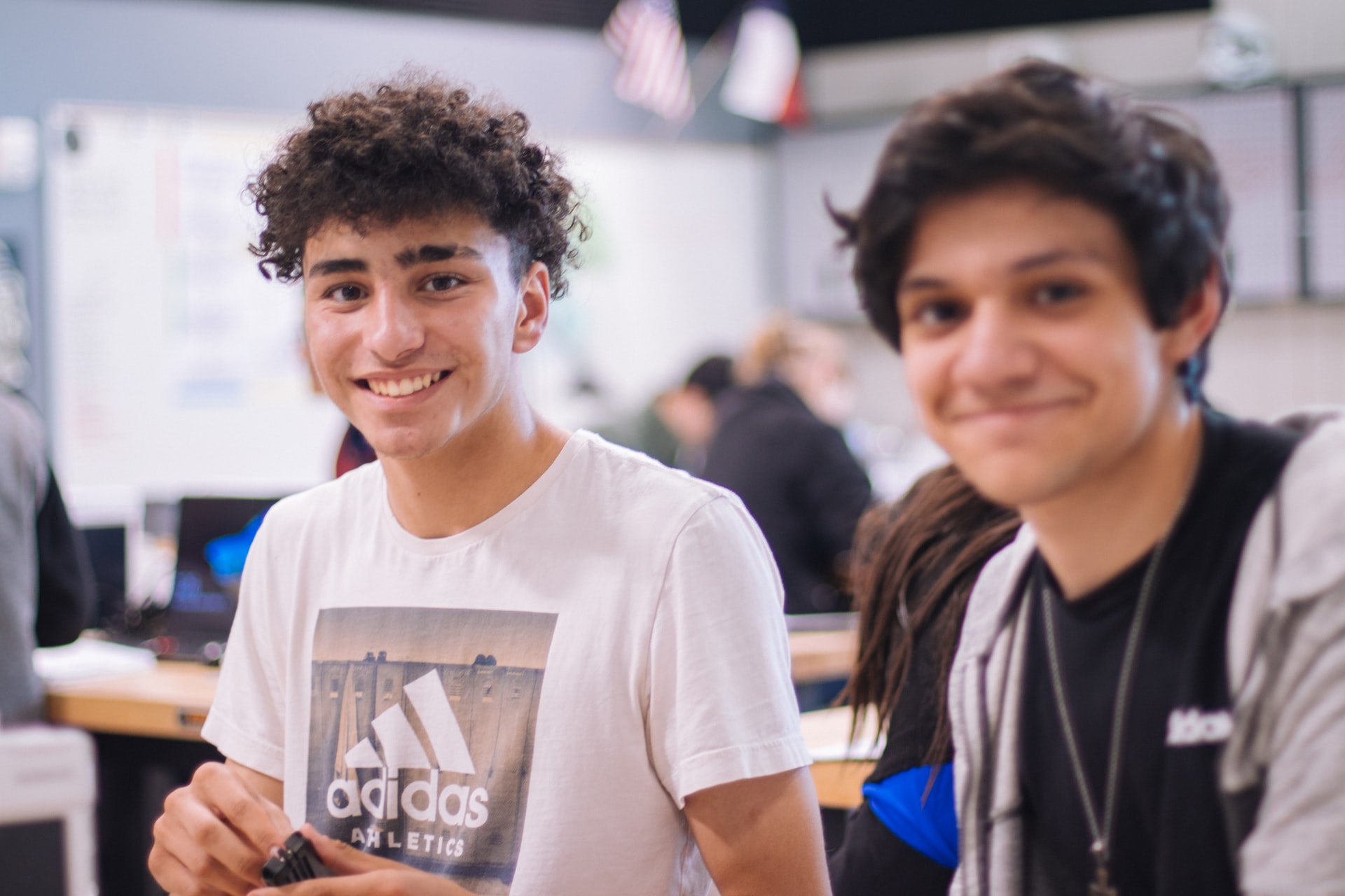 Two students smiling
