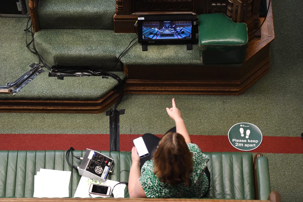 Someone is watching a screen in the House of Commons