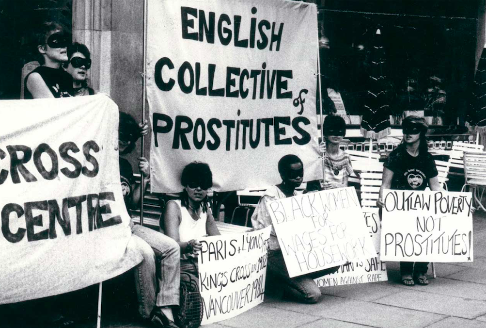 People are gathered with signs reading:English Collective of Prostitutes (ECP)' 